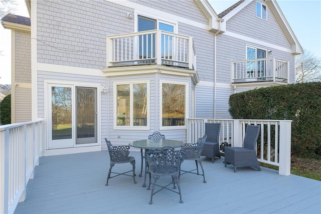 deck with outdoor dining area