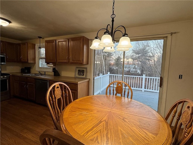 dining space with an inviting chandelier and dark wood-style flooring