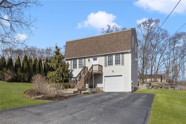 view of front of property featuring aphalt driveway, roof with shingles, stairway, a gambrel roof, and a front lawn