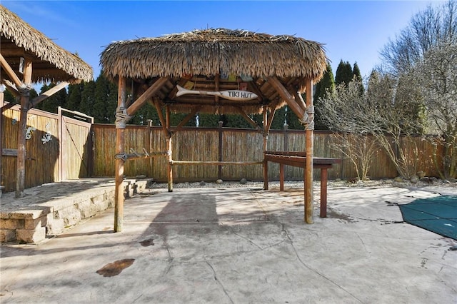 view of patio / terrace featuring a gazebo, a fenced in pool, and a fenced backyard