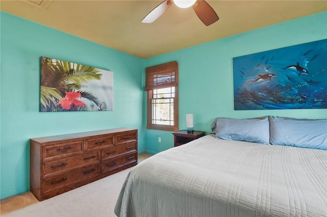 bedroom with baseboards, light carpet, and ceiling fan