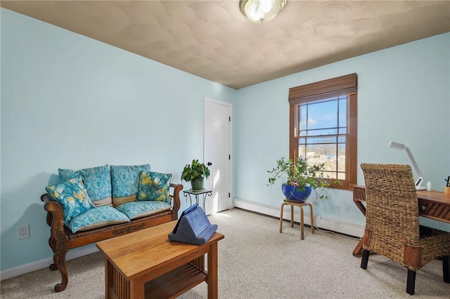 living area with light colored carpet and baseboards