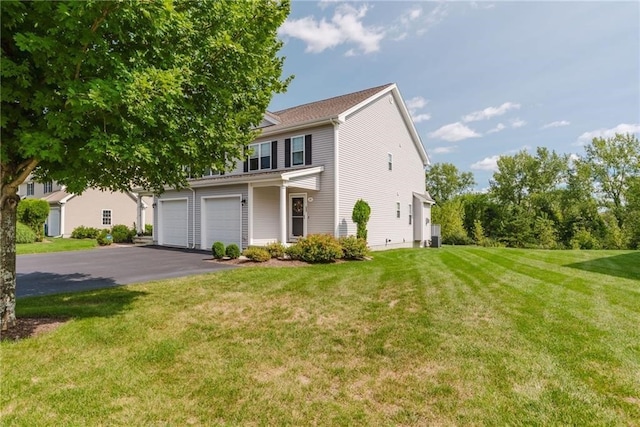 view of front of property featuring aphalt driveway, a garage, and a front lawn