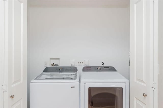 laundry area featuring washing machine and dryer and laundry area