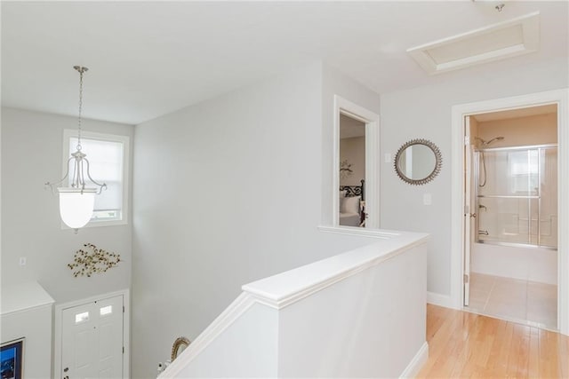 interior space featuring light wood-style flooring and baseboards