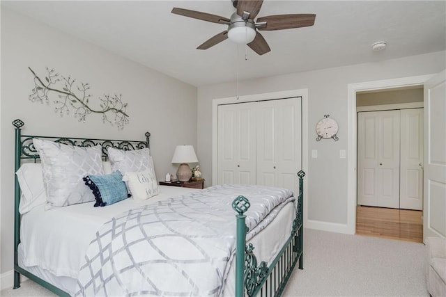 carpeted bedroom with a ceiling fan, baseboards, and a closet