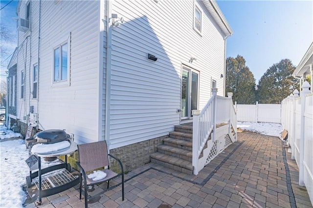 view of side of home with a patio area and a fenced backyard