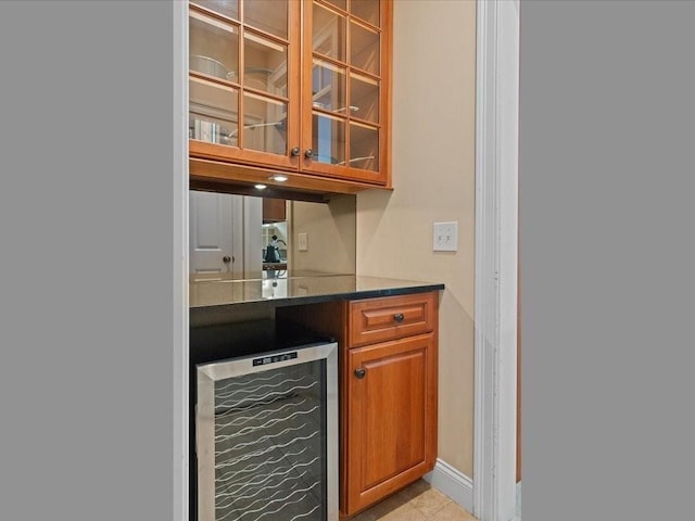 bar with baseboards and wine cooler