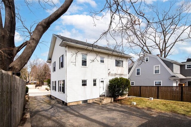 277 Waterman St, Providence, RI 02906 - back of property featuring entry steps, fence, and driveway