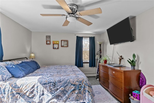 bedroom featuring ceiling fan and a baseboard radiator