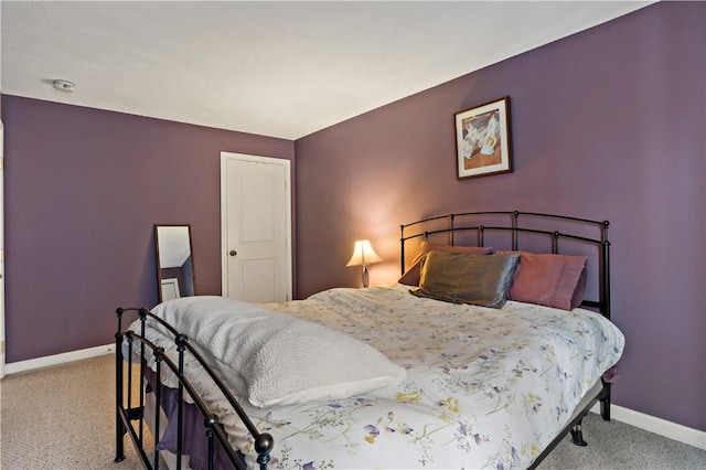 bedroom with carpet flooring and baseboards