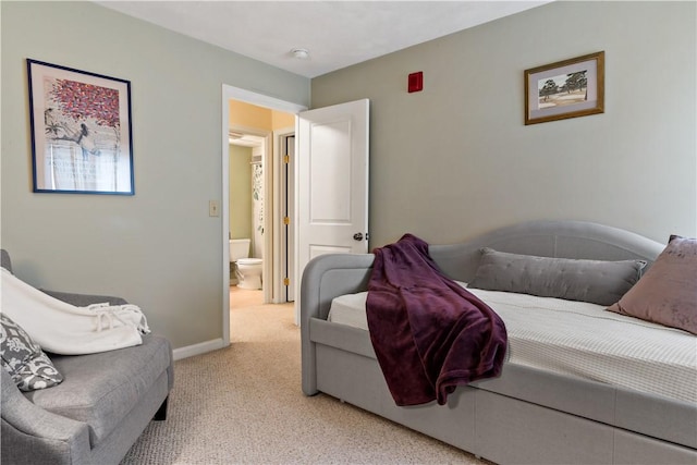 carpeted bedroom with baseboards