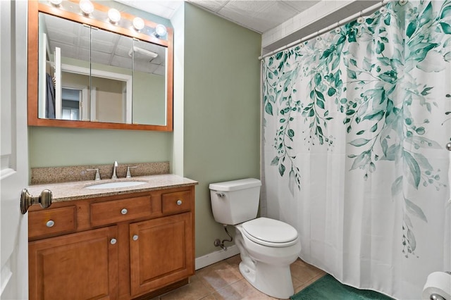 bathroom with vanity, a shower with shower curtain, baseboards, tile patterned floors, and toilet