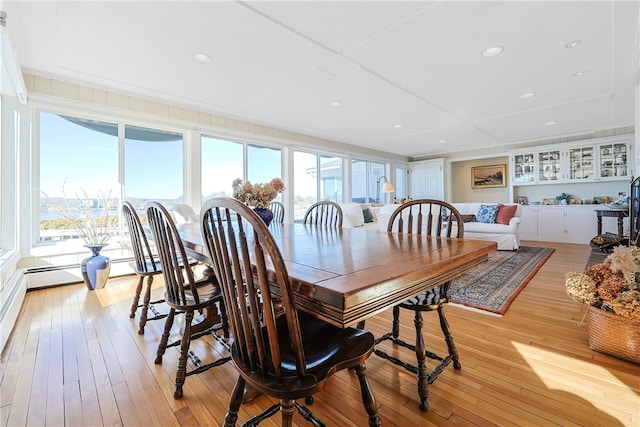 dining room with recessed lighting and light wood-type flooring