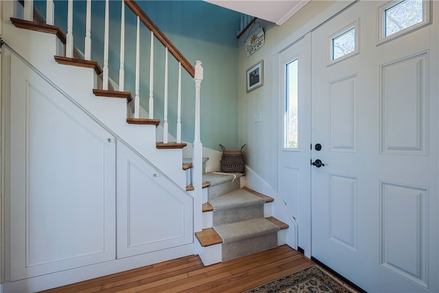 entrance foyer featuring hardwood / wood-style floors and stairs