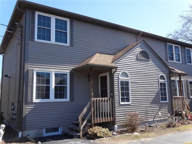 view of front of house with a shingled roof