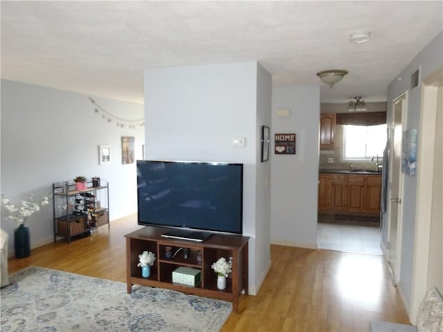 living room featuring light wood-type flooring