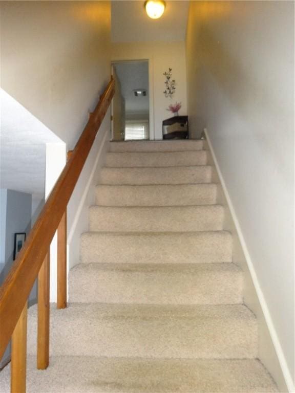 stairway with baseboards