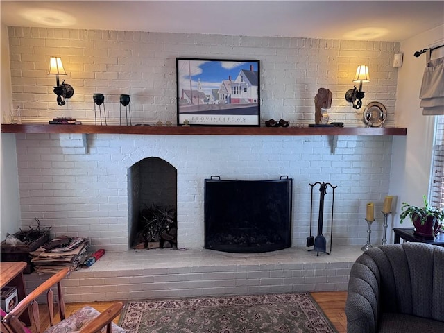 living room featuring wood finished floors and a fireplace