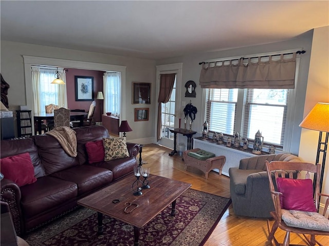 living area featuring light wood-type flooring and a wealth of natural light