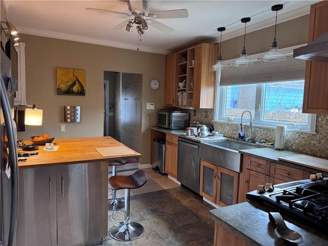 kitchen with brown cabinets, stainless steel appliances, and a sink