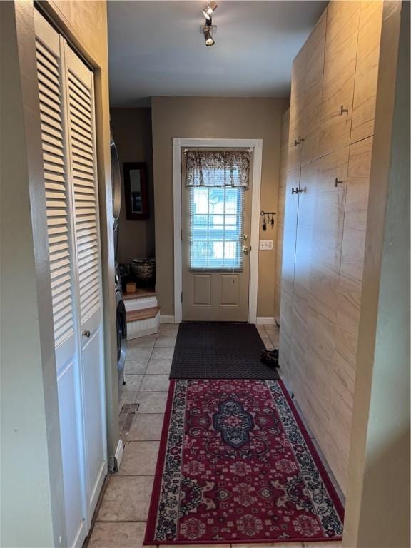 entryway featuring light tile patterned flooring