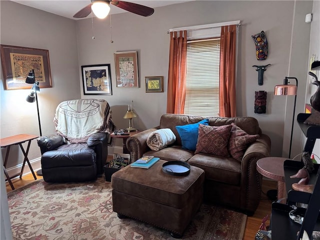 living room with ceiling fan and wood finished floors