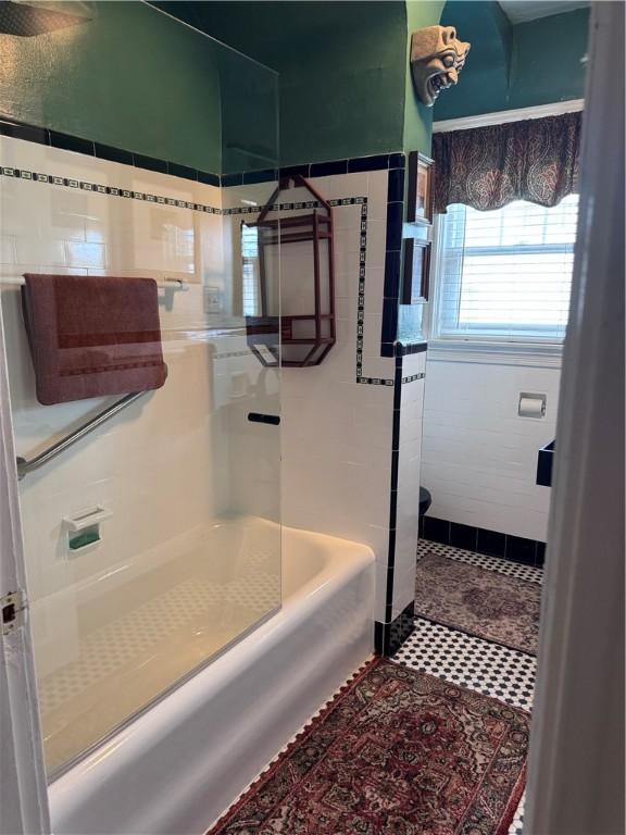 bathroom with tile patterned flooring and toilet