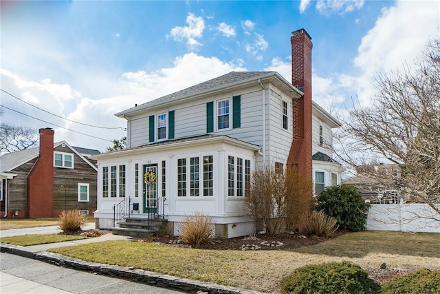 traditional style home with a chimney