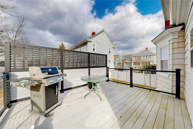 wooden deck with grilling area