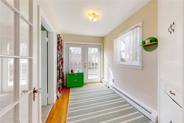 entryway with french doors and baseboard heating