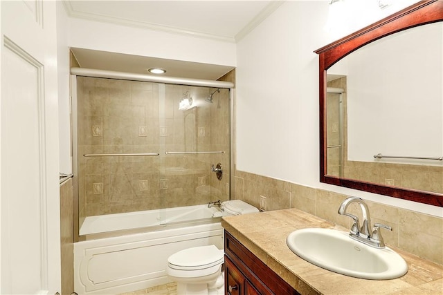 full bath with vanity, crown molding, toilet, and shower / tub combination