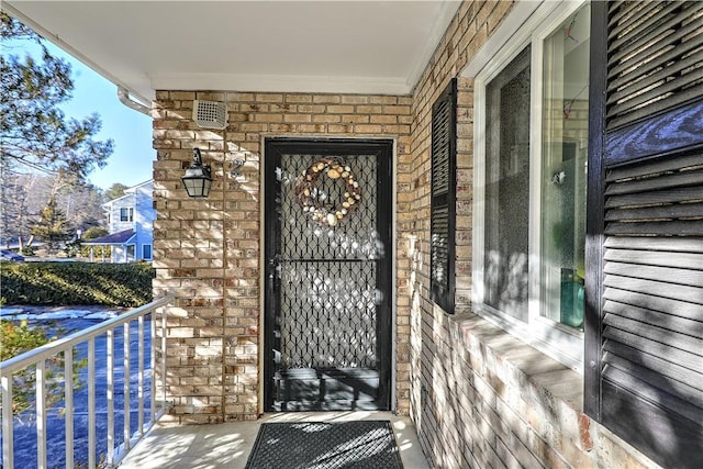 property entrance with a balcony