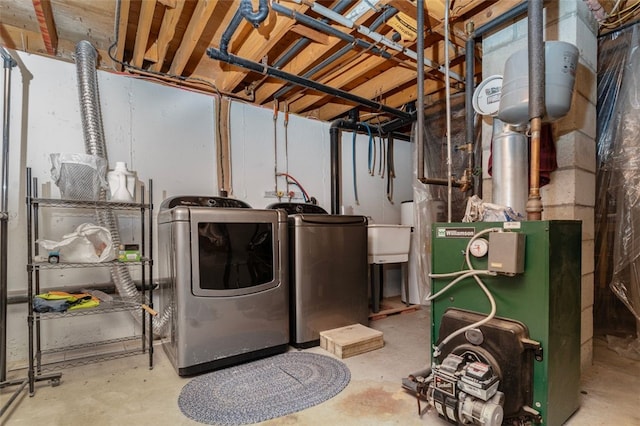 laundry area with washing machine and clothes dryer and laundry area