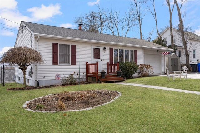 ranch-style home featuring driveway, an attached garage, a front lawn, and fence