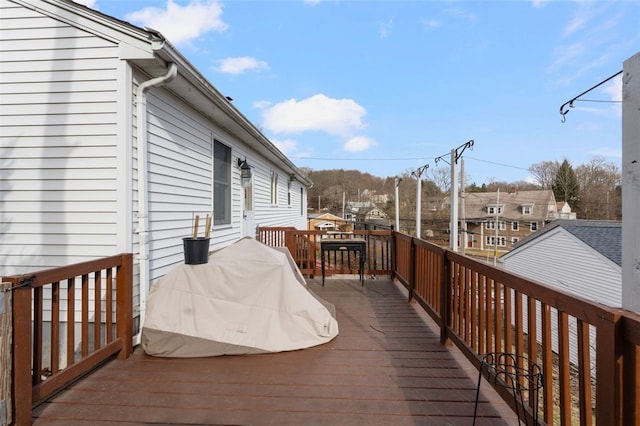 wooden terrace featuring a residential view