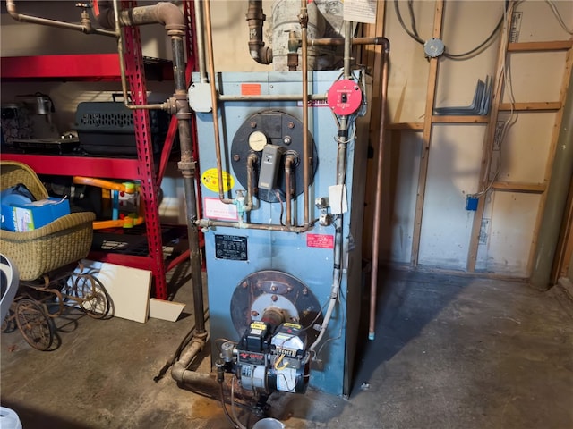 utility room featuring heating unit