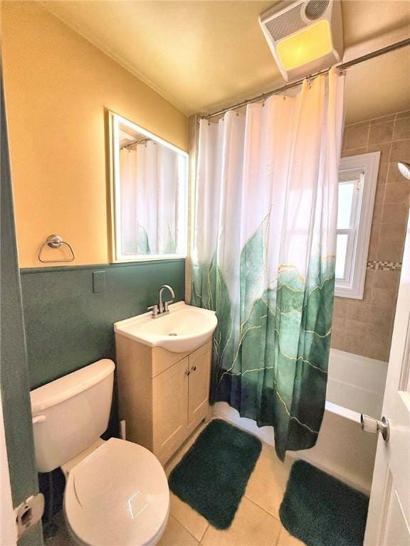 bathroom with tile patterned flooring, plenty of natural light, vanity, and shower / tub combo with curtain