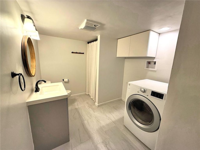 laundry room with baseboards, washer / dryer, laundry area, a sink, and marble finish floor