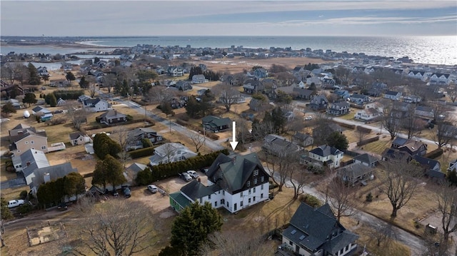 drone / aerial view featuring a water view and a residential view