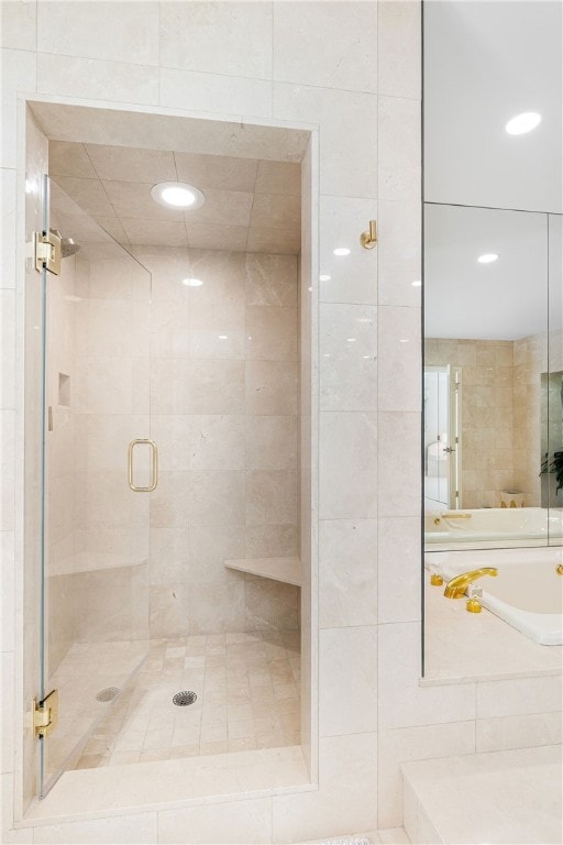 full bath with a shower stall