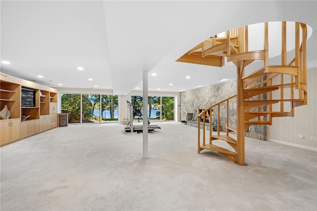 workout room featuring recessed lighting and light carpet