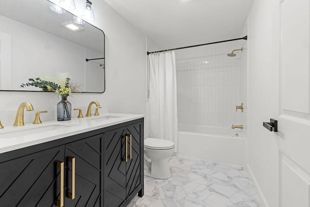 bathroom featuring shower / bath combination with curtain, toilet, marble finish floor, and a sink