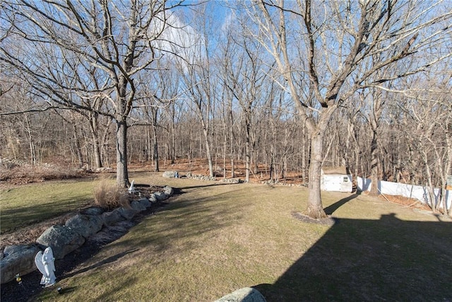 view of yard with a wooded view