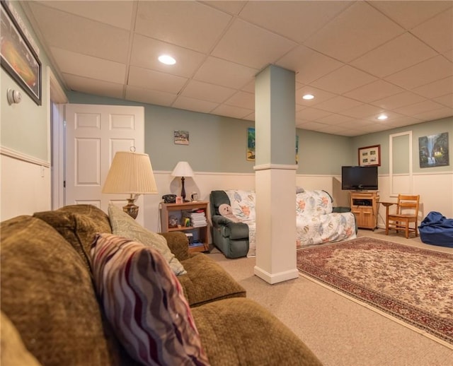 carpeted living room with recessed lighting, a paneled ceiling, and wainscoting