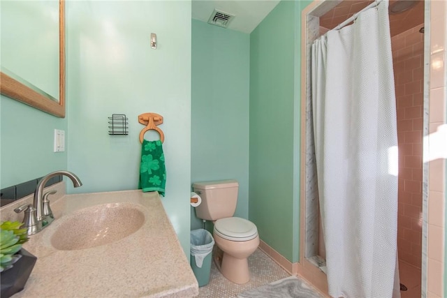 full bathroom featuring visible vents, toilet, a stall shower, tile patterned flooring, and vanity