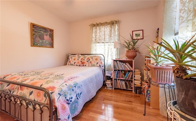 bedroom with wood finished floors