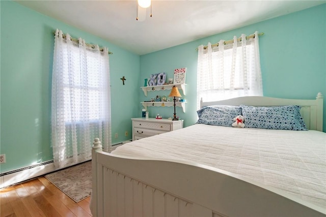 bedroom featuring ceiling fan and wood finished floors