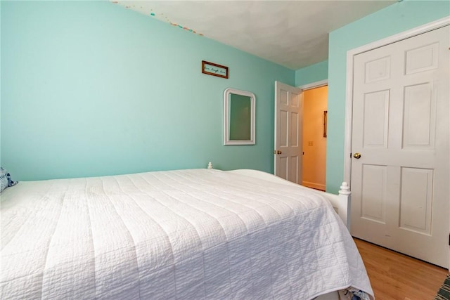 bedroom featuring wood finished floors