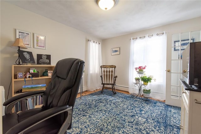 office featuring a baseboard radiator and baseboards